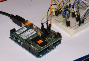 Arduino with GSM module (a makeshift power supply in the background)